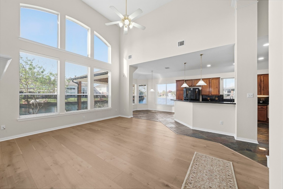 10103 Lazy Lagoon Houston, TX 77065 - Photo 15 of 50 a view of an empty room with a kitchen