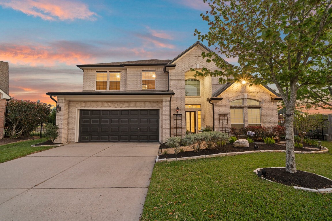 10103 Lazy Lagoon Houston, TX 77065 - Photo 2 of 50 a front view of a house with garden