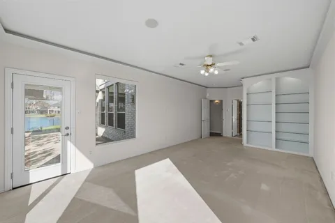a view of livingroom with an empty space & kitchen view
