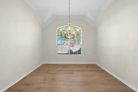 a bathroom with a granite countertop sink a mirror and shower