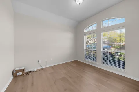 a bathroom with a double vanity sink toilet mirror and shower