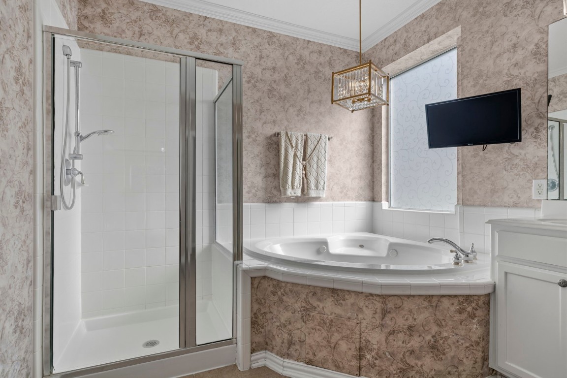 10103 Lazy Lagoon Houston, TX 77065 - Photo 29 of 50 a bathroom with a granite countertop sink a mirror and shower