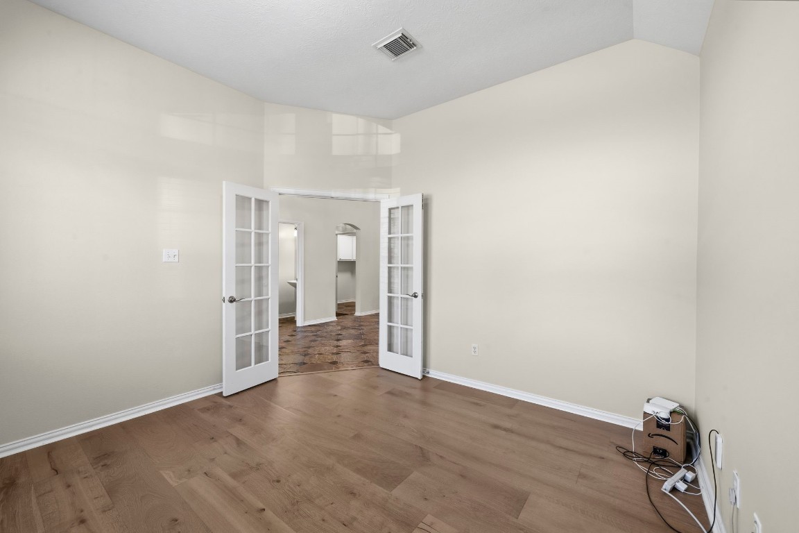 10103 Lazy Lagoon Houston, TX 77065 - Photo 33 of 50 a view of a room with wooden floor