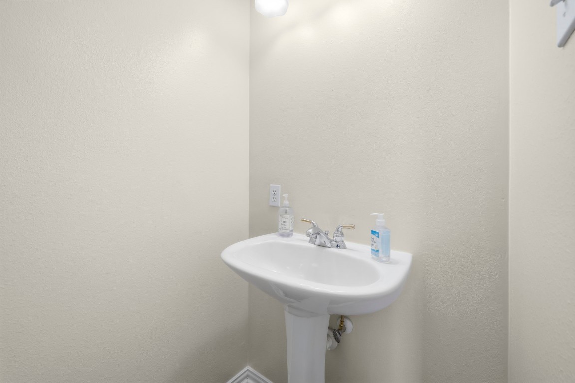 10103 Lazy Lagoon Houston, TX 77065 - Photo 34 of 50 a bathroom with a sink and a mirror