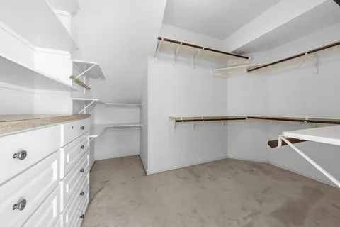 a view of an empty walk in closet