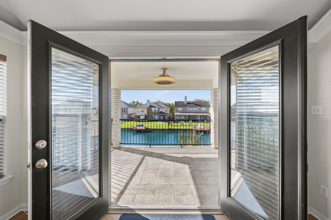 10103 Lazy Lagoon Houston, TX 77065 - Photo 38 of 50 a picture of a glass door with a outdoor space