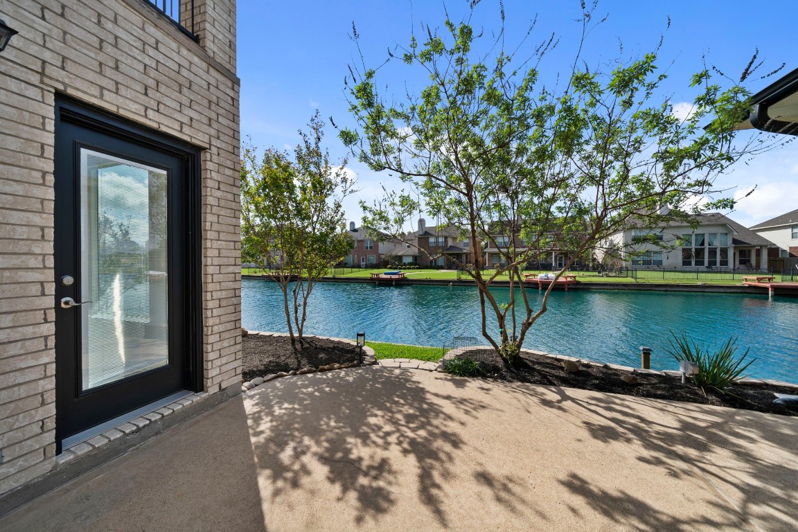 10103 Lazy Lagoon Houston, TX 77065 - Photo 40 of 50 a house with a lake view