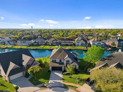 an aerial view of a house with a ocean view
