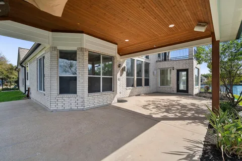 a front view of a house with a large window