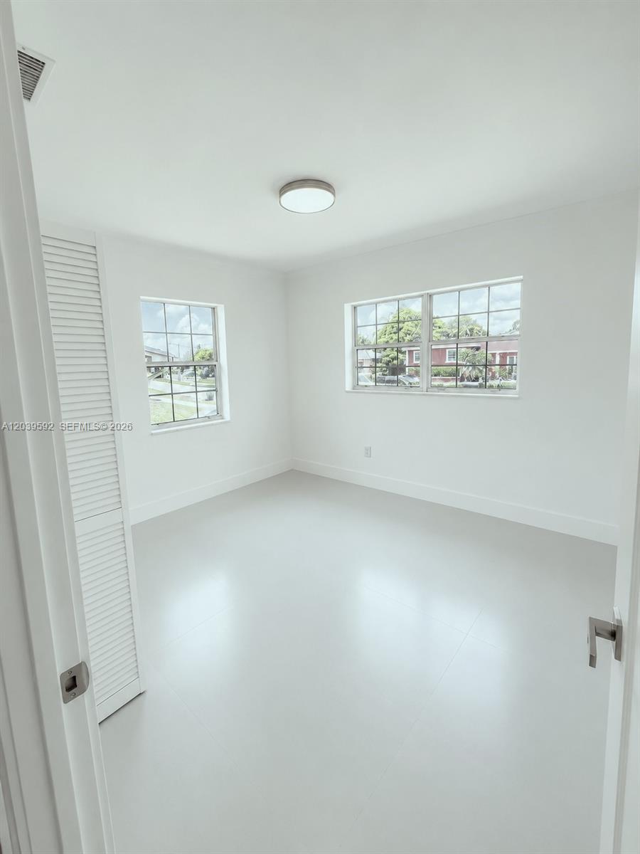 18935 Northwest 8th Avenue Miami Gardens, FL 33169 - Photo 19 of 26 an empty room with windows