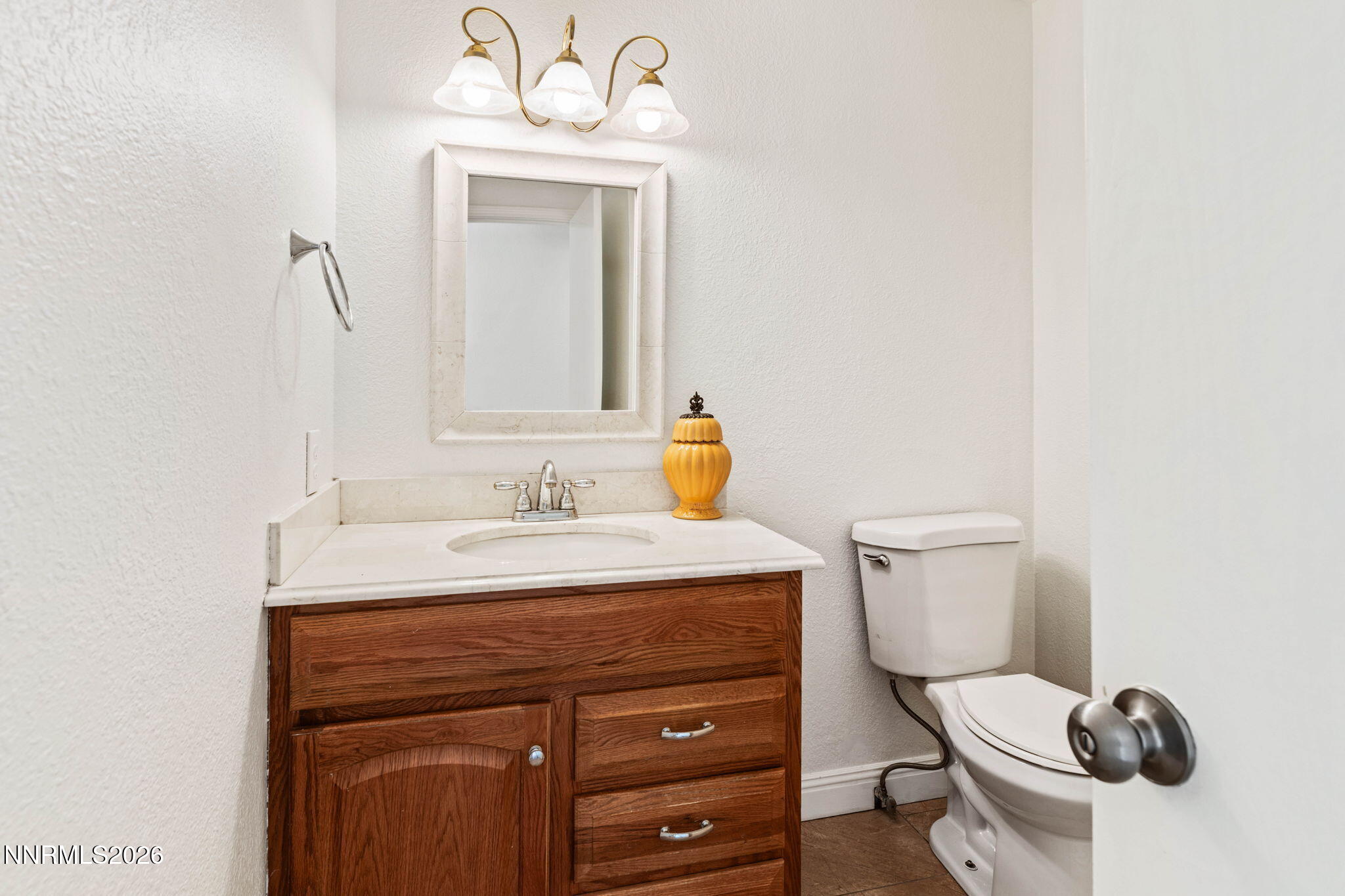 1663 Mackland Avenue Minden, NV 89423 - Photo 11 of 27 a bathroom with a sink vanity mirror and toilet