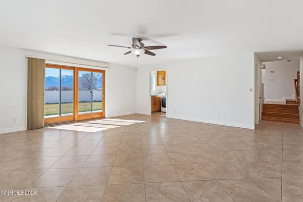 a bathroom with a granite countertop sink a mirror and a shower