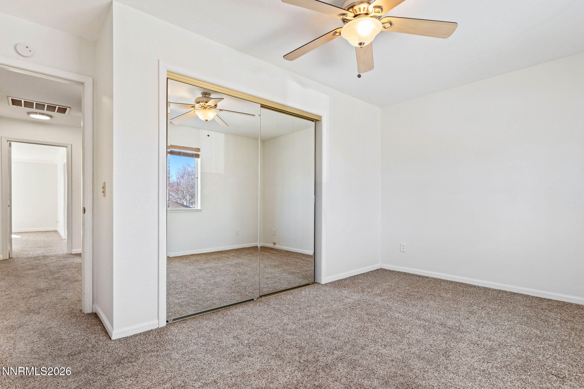 1663 Mackland Avenue Minden, NV 89423 - Photo 20 of 27 an empty room with fan and entrance