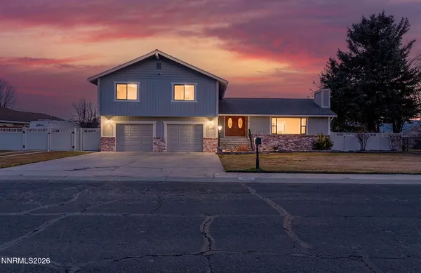 a front view of a house with yard