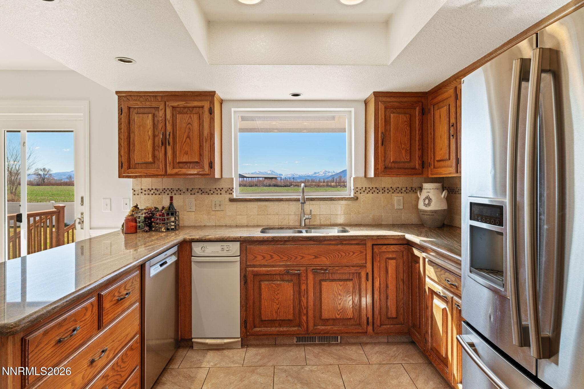 1663 Mackland Avenue Minden, NV 89423 - Photo 6 of 27 a kitchen with a sink stove and refrigerator