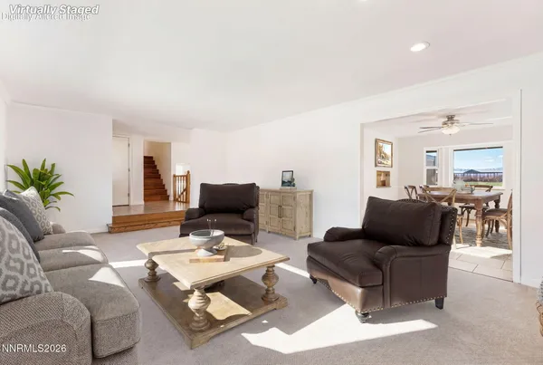 a bedroom with a bed and a television