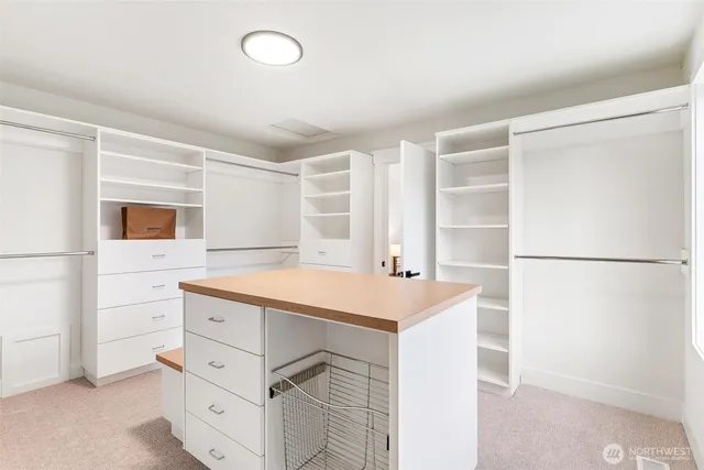 a bedroom with a bed and a night stand