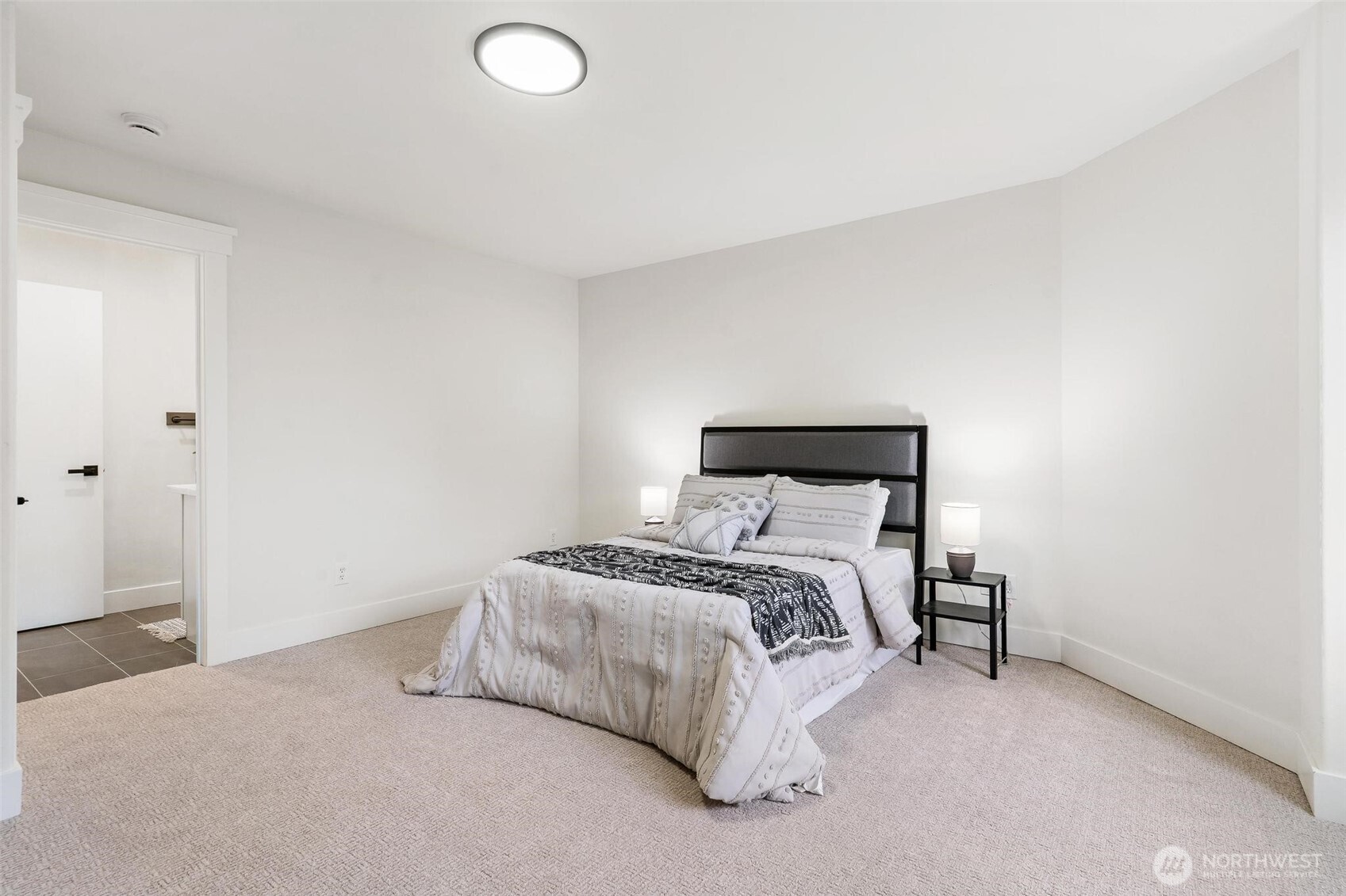 223 South Camano Ridge Road Camano Island, WA 98282 - Photo 12 of 40 a bedroom with a bed and a night stand