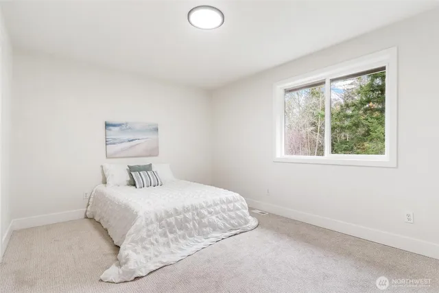 a view of staircase with wooden floor and white walls