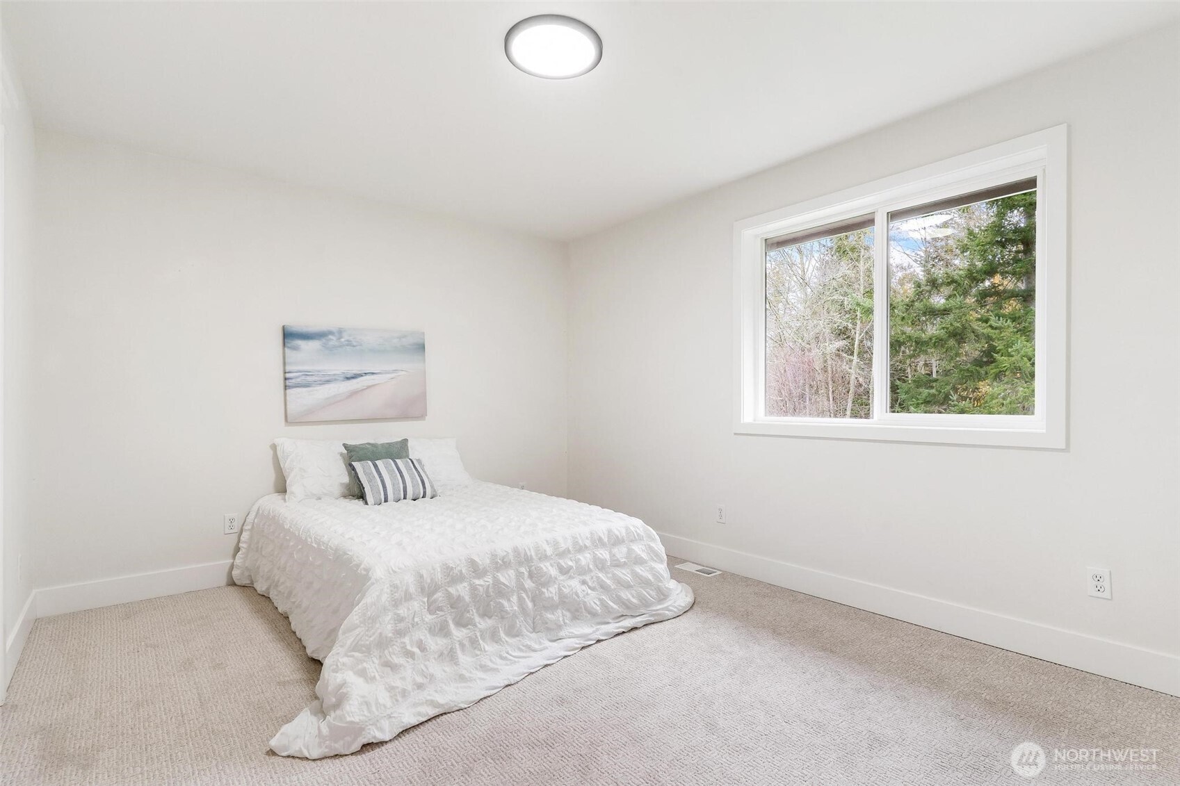 223 South Camano Ridge Road Camano Island, WA 98282 - Photo 16 of 40 a bedroom with a bed and a window