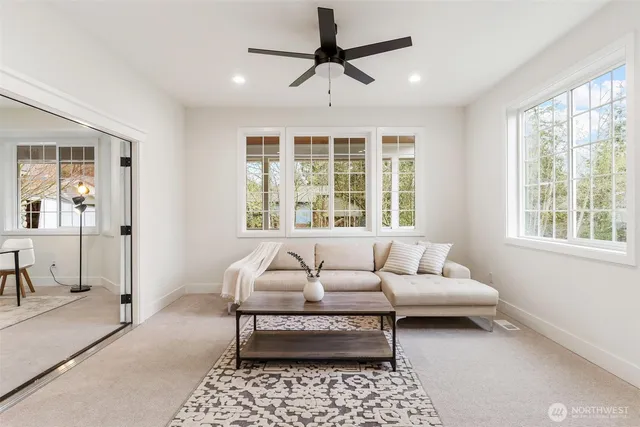 a view of a livingroom with furniture and window