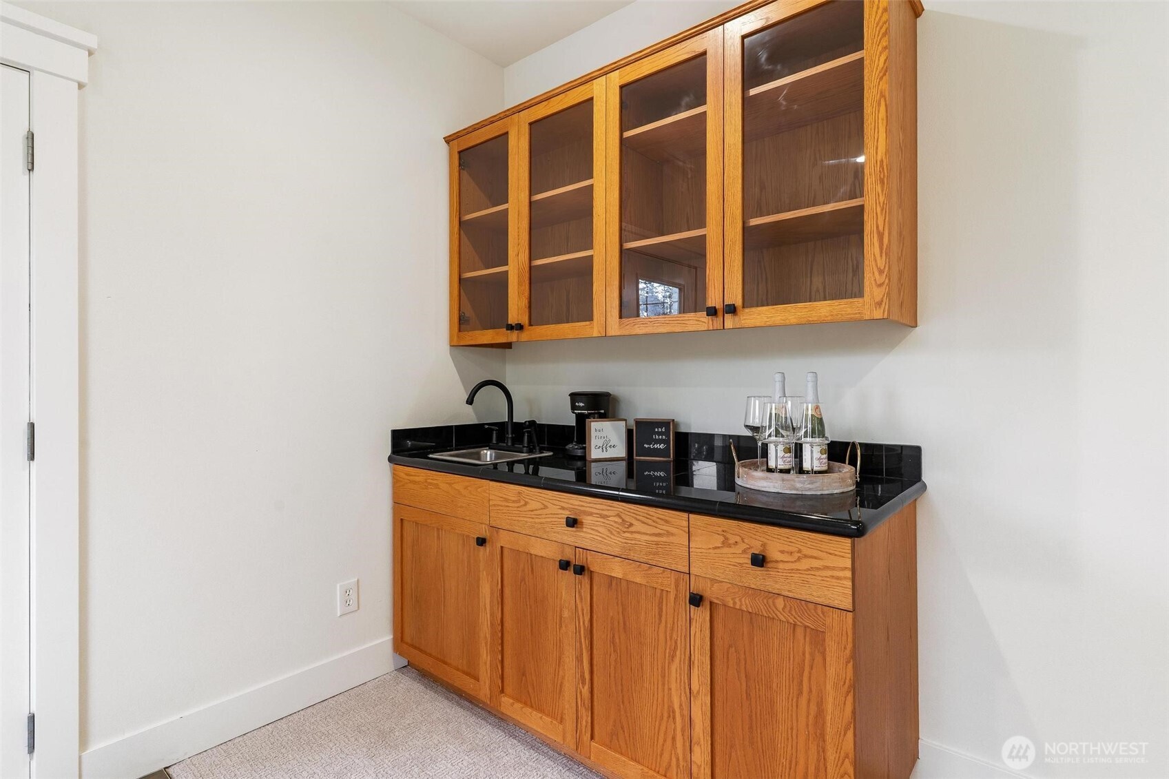 223 South Camano Ridge Road Camano Island, WA 98282 - Photo 22 of 40 a kitchen with granite countertop a sink and cabinets