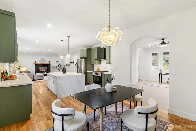 a kitchen with stainless steel appliances kitchen island a stove and a refrigerator
