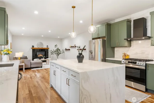 a kitchen with a stove and a refrigerator
