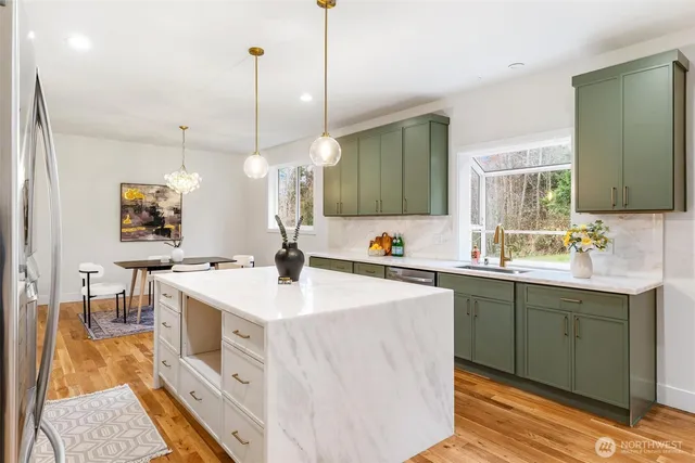 a kitchen with a sink and a large window