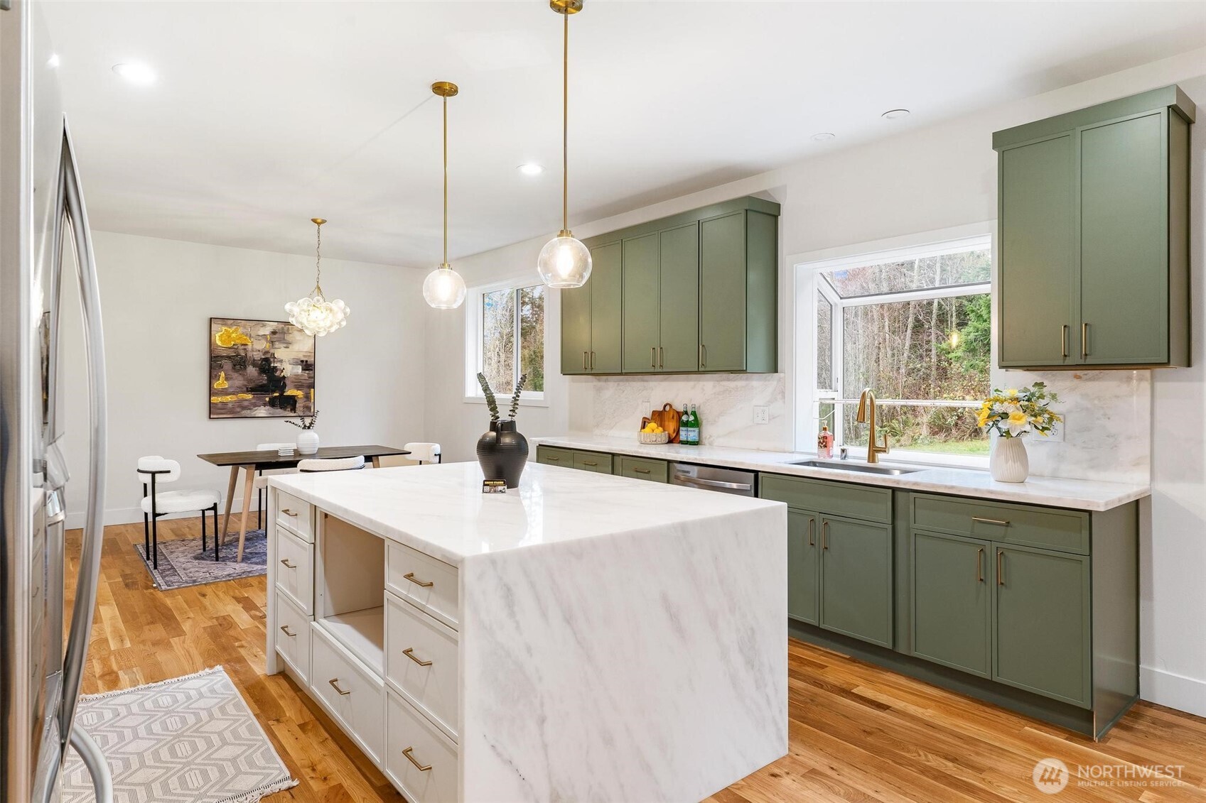223 South Camano Ridge Road Camano Island, WA 98282 - Photo 26 of 40 a kitchen with a sink a counter space appliances and cabinets