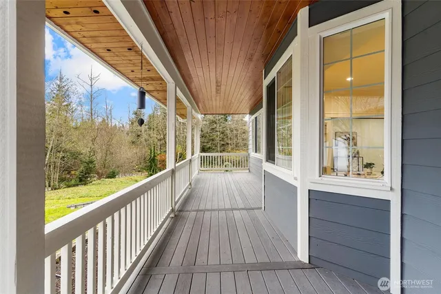 a view of a balcony with wooden floor