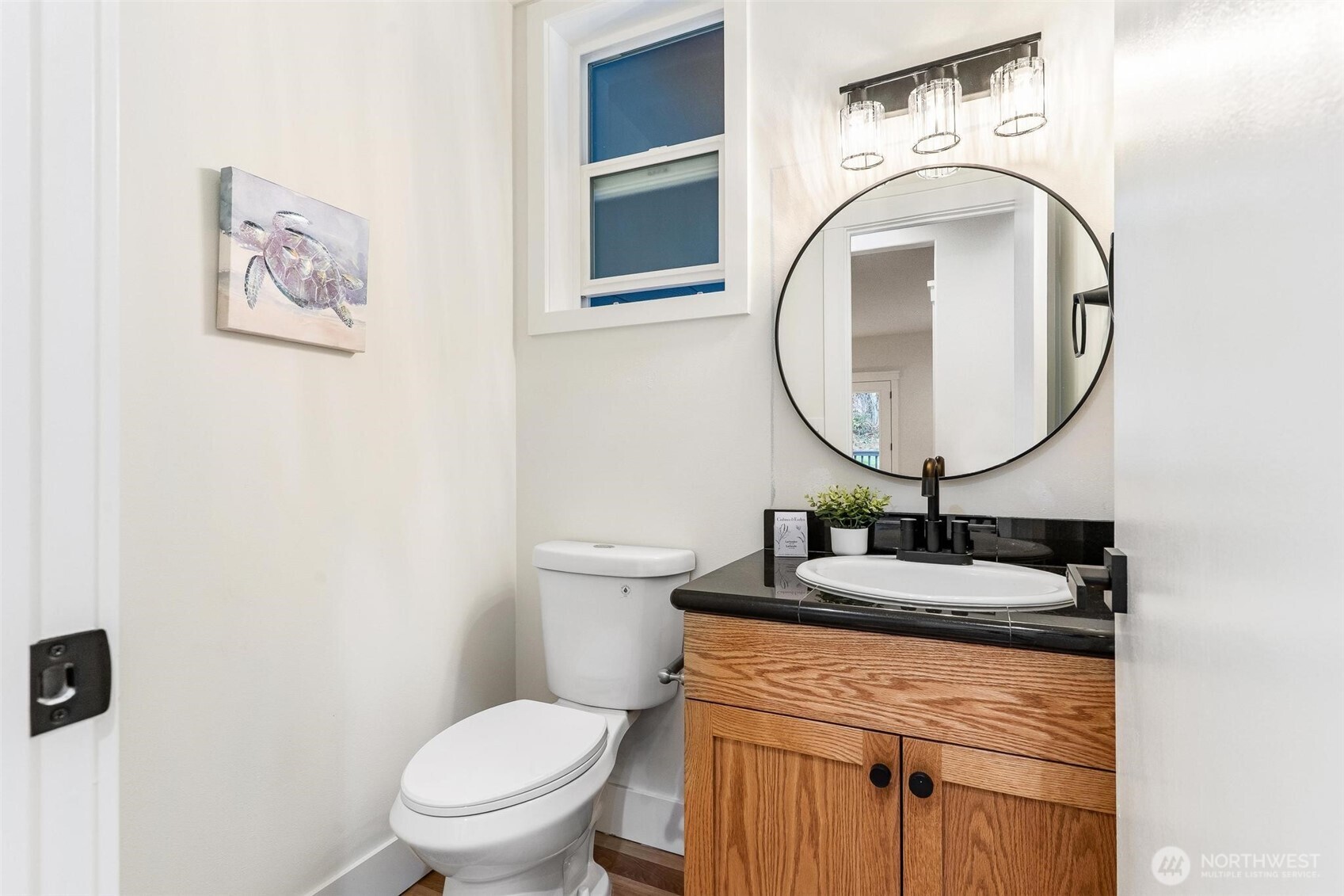 223 South Camano Ridge Road Camano Island, WA 98282 - Photo 32 of 40 a bathroom with a toilet sink and mirror