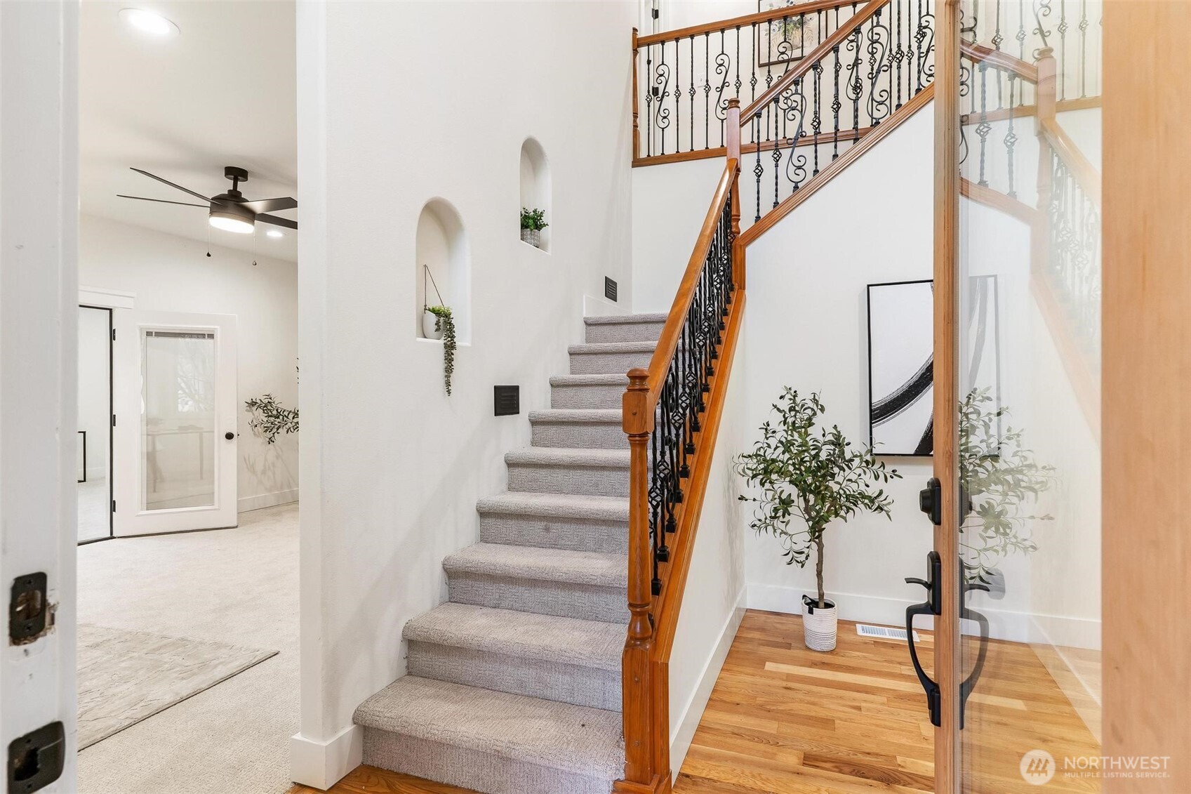 223 South Camano Ridge Road Camano Island, WA 98282 - Photo 34 of 40 a view of staircase with white walls and a chandelier