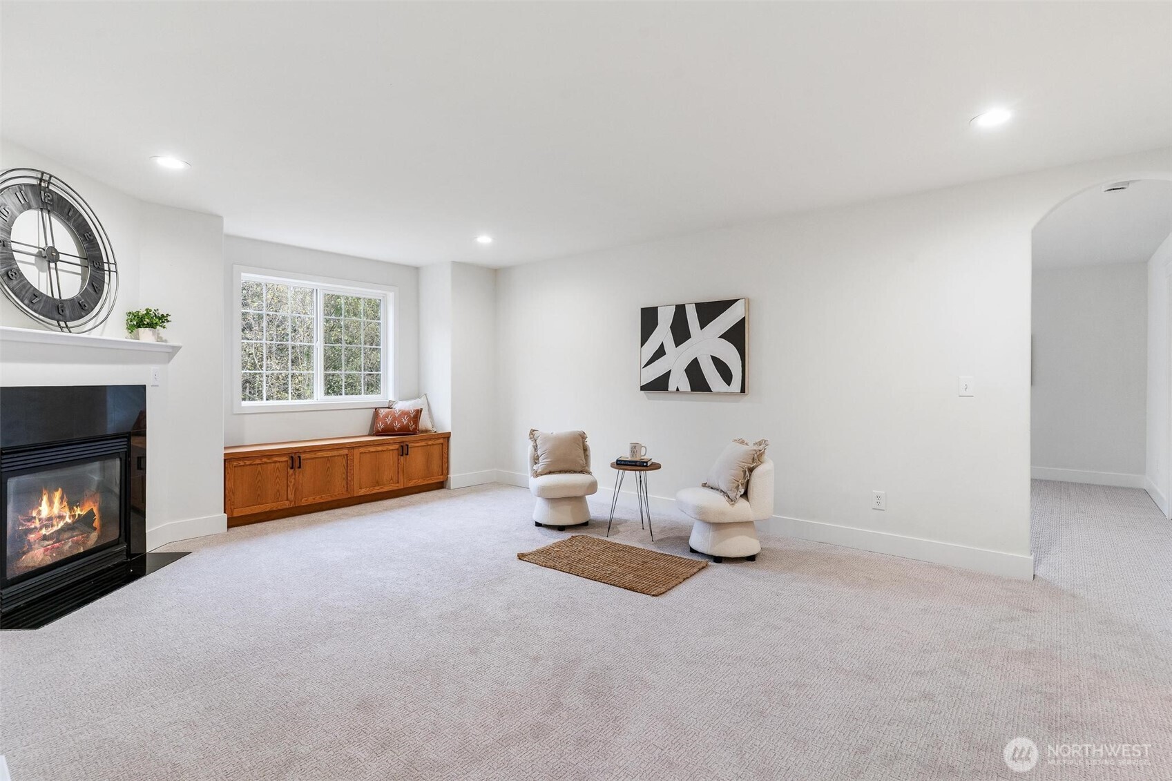 223 South Camano Ridge Road Camano Island, WA 98282 - Photo 5 of 40 a living room with furniture and a fireplace