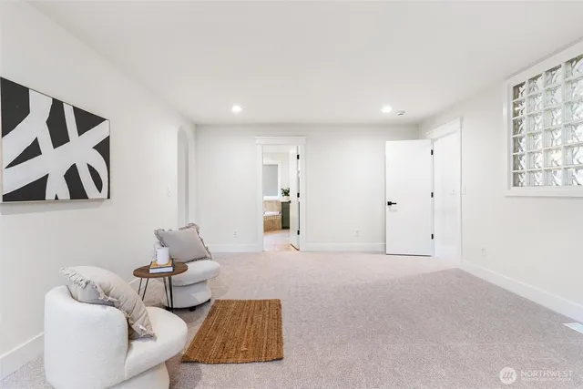 a spacious bathroom with a double vanity sink mirror and bathtub