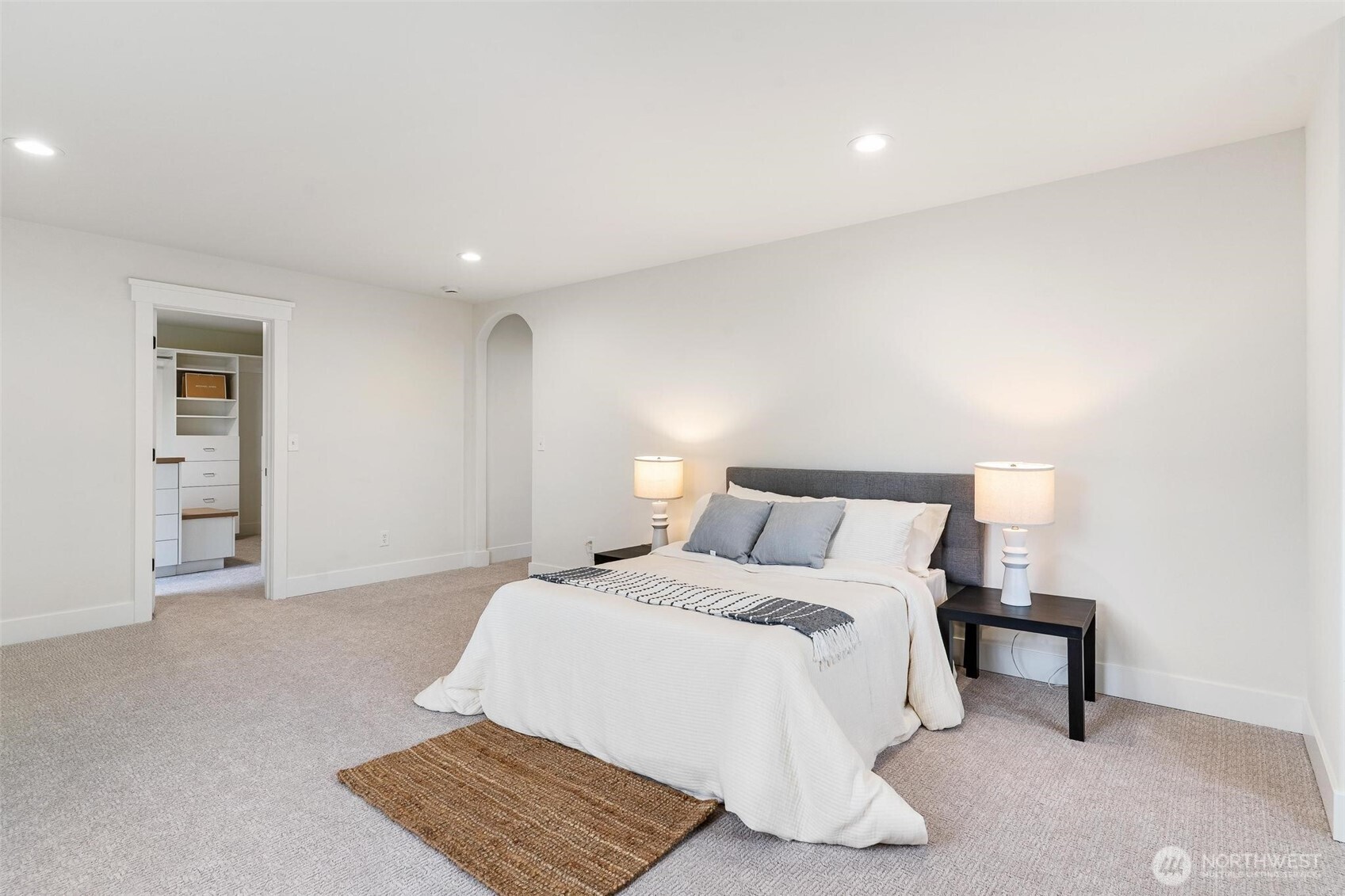 223 South Camano Ridge Road Camano Island, WA 98282 - Photo 9 of 40 a bedroom with a bed and a night stand