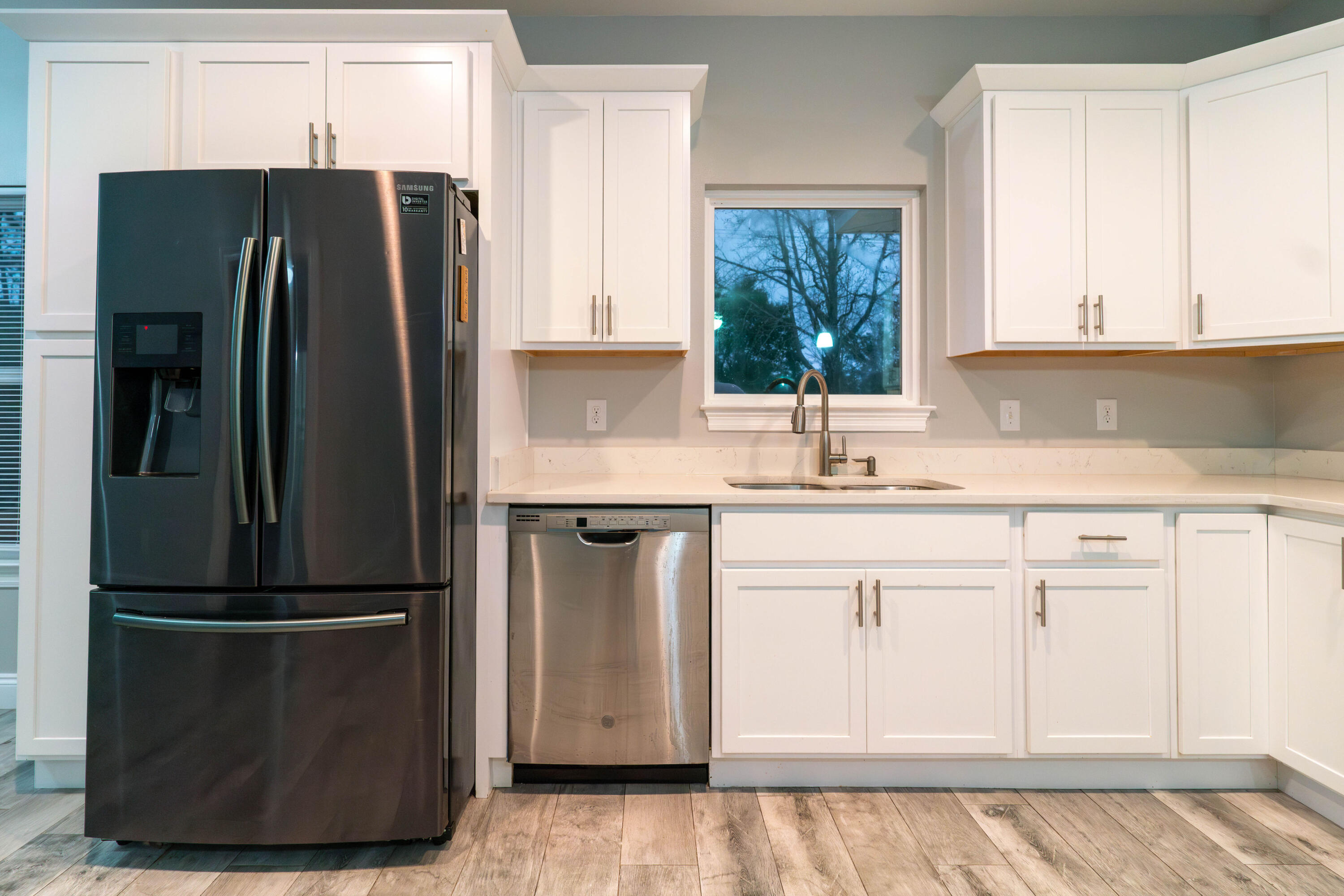 2243 Wind Trace Road North Navarre, FL 32566 - Photo 11 of 34 a kitchen with stainless steel appliances granite countertop a refrigerator sink and cabinets