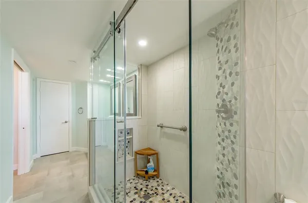 a bathroom with a shower and a toilet