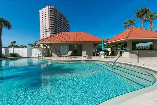 a patio with table and chairs