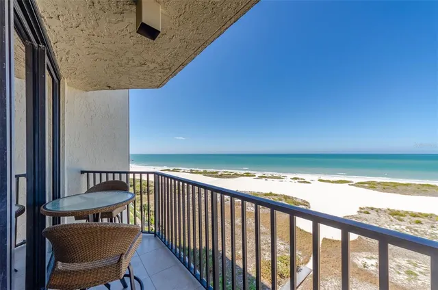 a view of a chair and table in the balcony