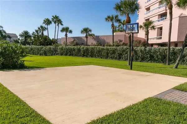 a front view of a building with parking area