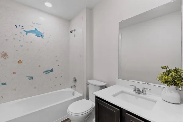 a bathroom with a sink a toilet and bathtub