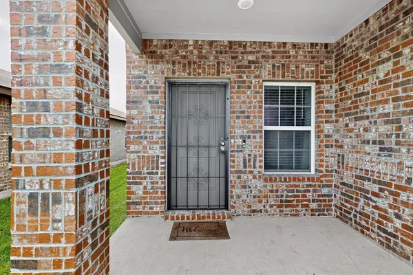 a kitchen with stainless steel appliances granite countertop a refrigerator a stove top oven a sink dishwasher and white cabinets with wooden floor