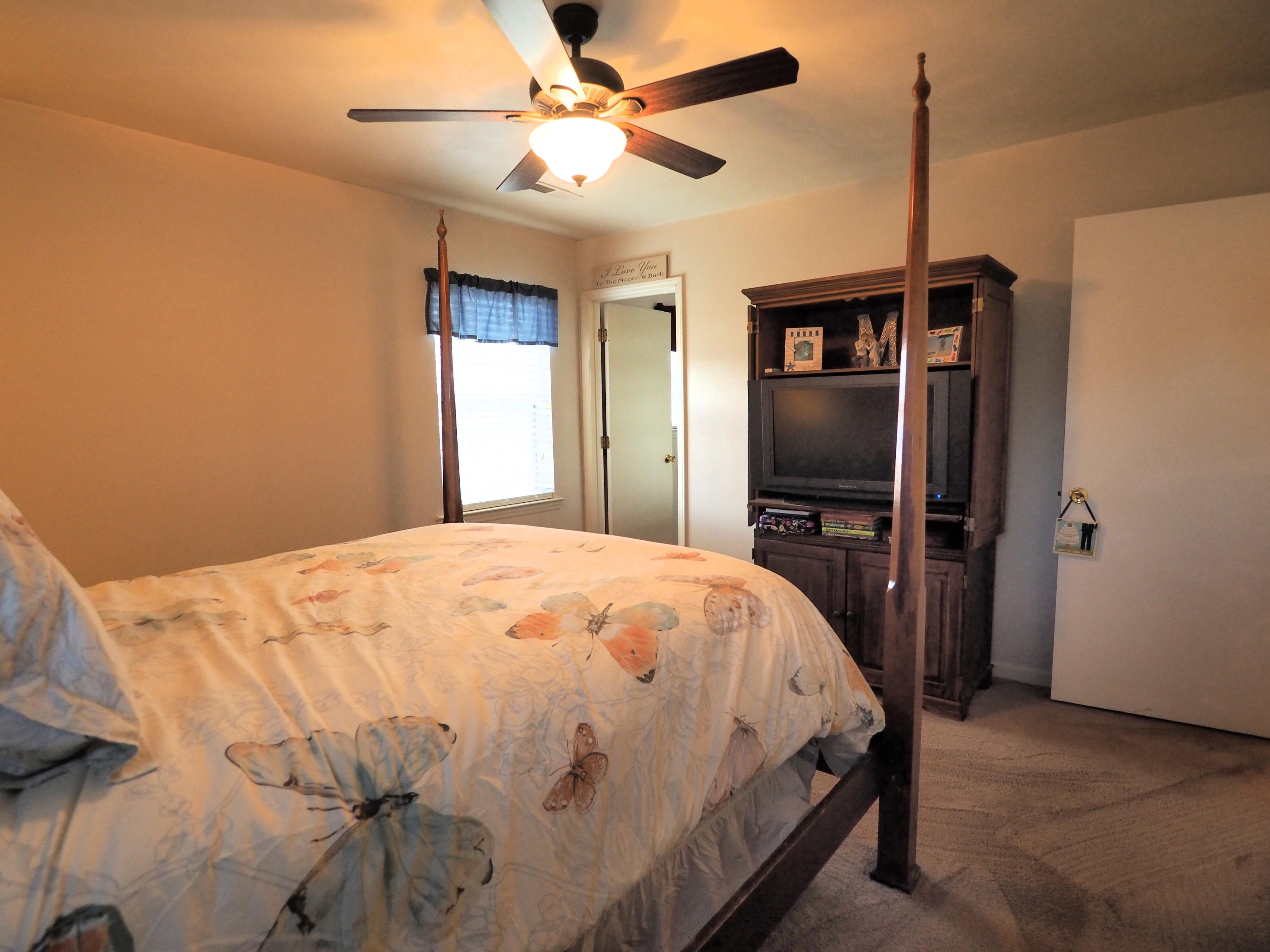 3118 Bandy Road Roanoke, VA 24014 - Photo 7 of 17 a bedroom with a bed and a flat tv screen on dresser