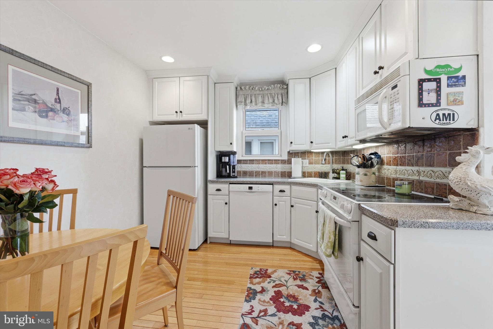 148 Sycamore Road Havertown, PA 19083 - Photo 12 of 29 a kitchen with a white cabinets and refrigerator