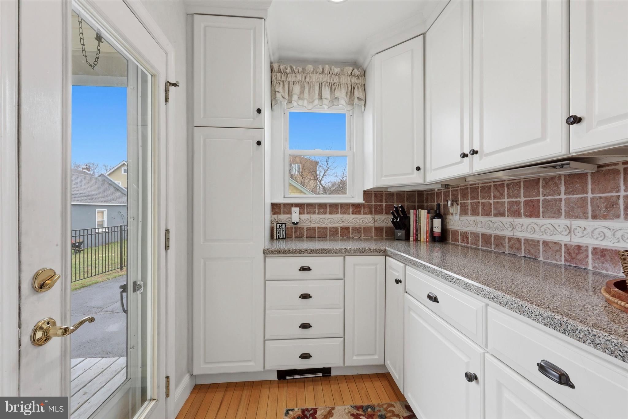 148 Sycamore Road Havertown, PA 19083 - Photo 14 of 29 a kitchen with white cabinets and window