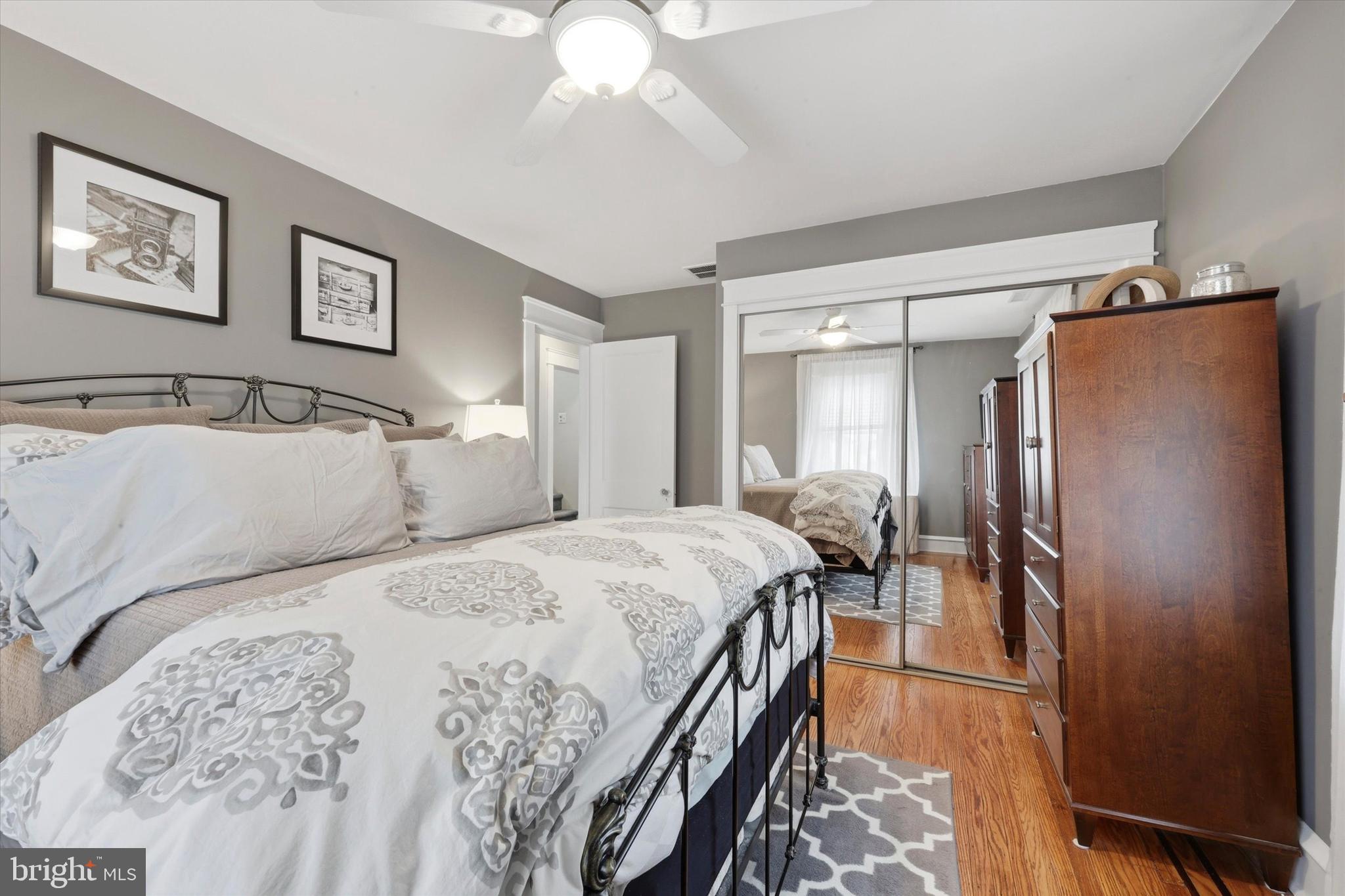 148 Sycamore Road Havertown, PA 19083 - Photo 16 of 29 a bedroom with a bed and a chandelier