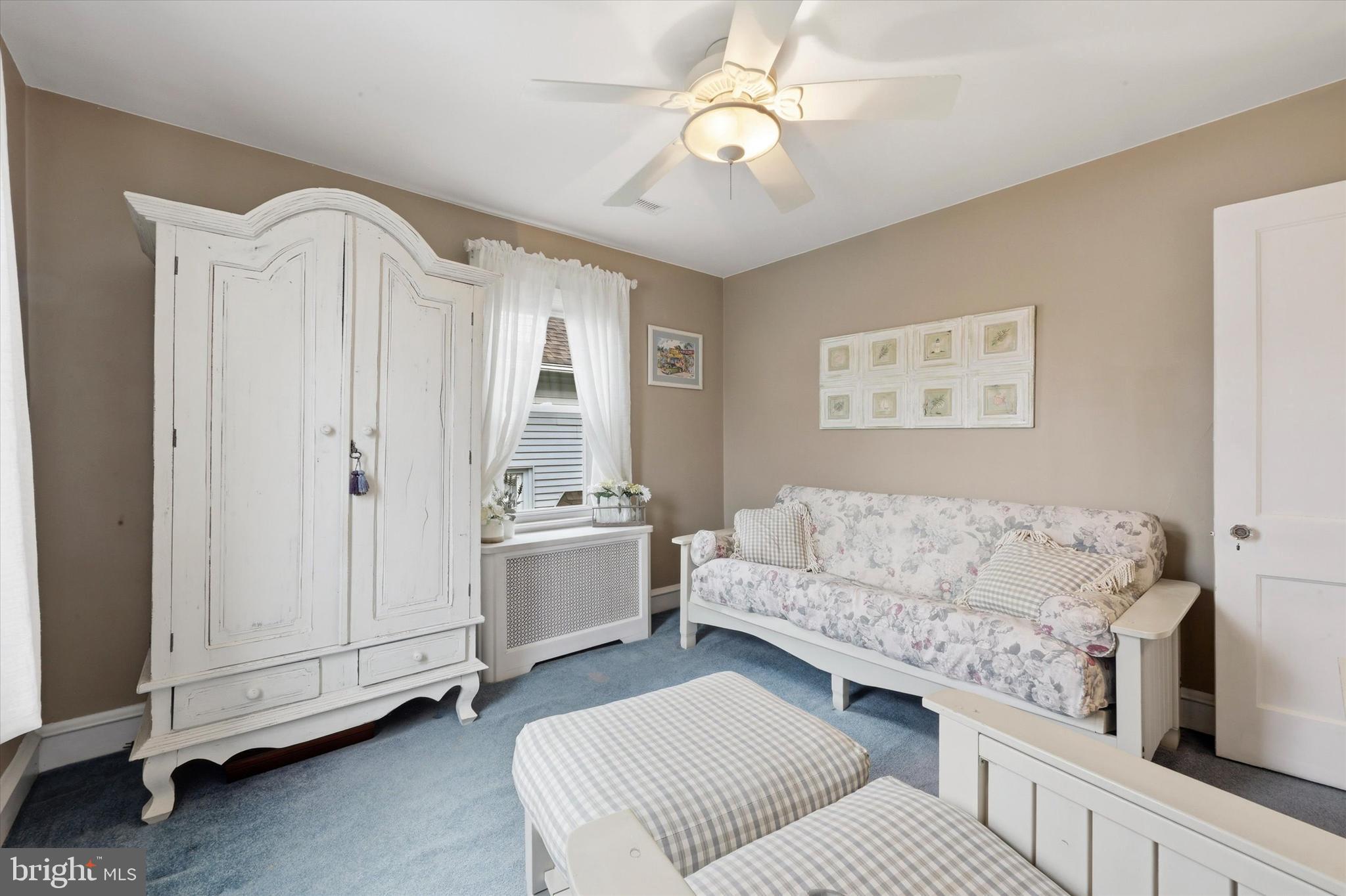 148 Sycamore Road Havertown, PA 19083 - Photo 19 of 29 a living room with furniture and a chandelier