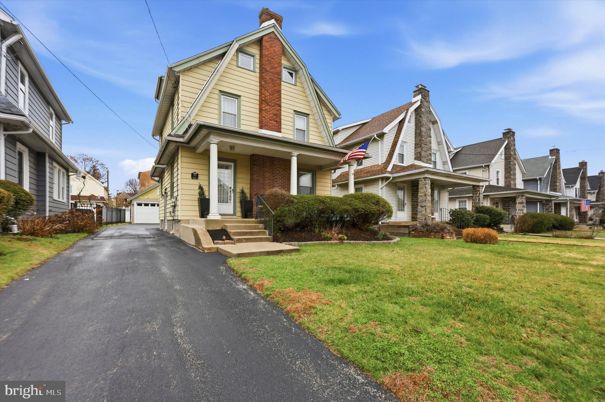 148 Sycamore Road Havertown, PA 19083 - Photo 2 of 29 a view of a white house next to a yard with big trees