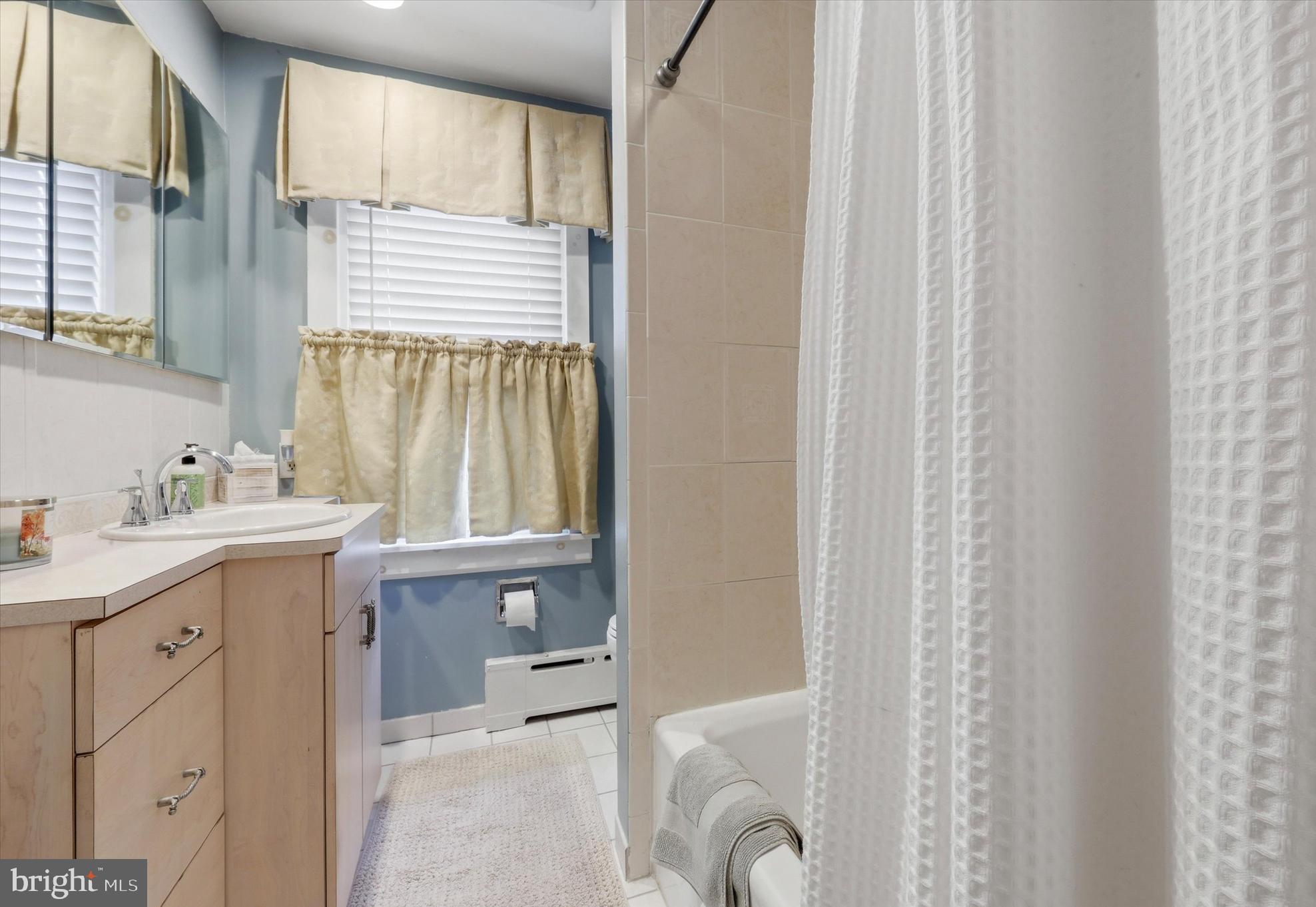 148 Sycamore Road Havertown, PA 19083 - Photo 21 of 29 a bathroom with a granite countertop sink and a mirror